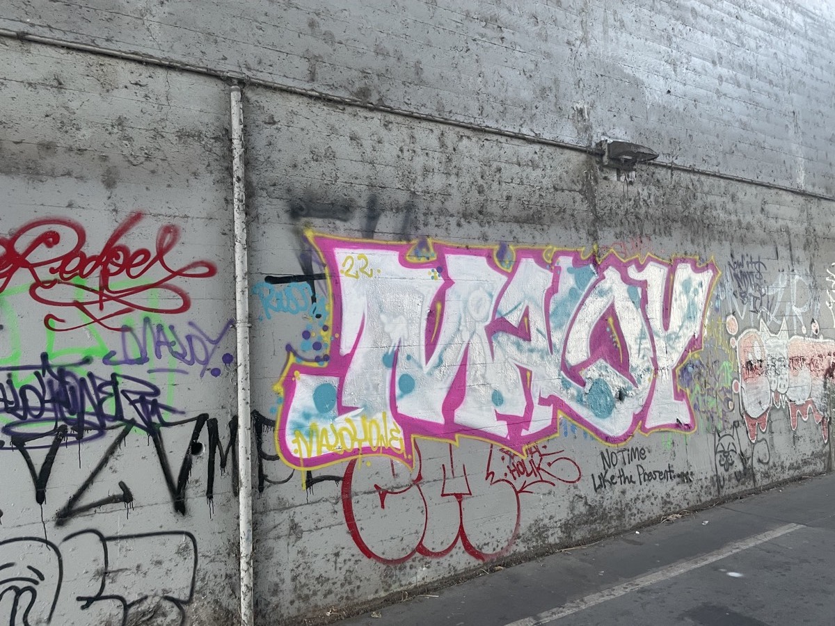 Graffiti on a wall under the bridge